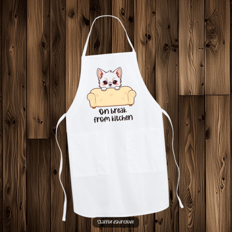 Funny Kawaii Staffordshire Apron, featuring a cute Staffy peeking over a couch, adding playful flair to kitchen duties.