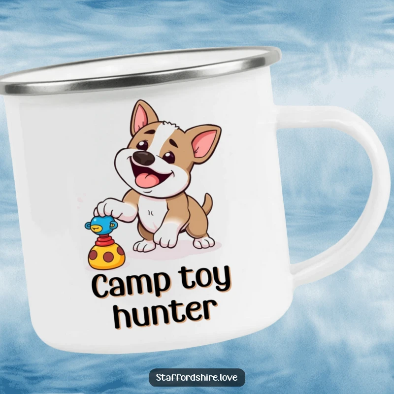 Funny camping mug with a happy Staffordshire dog playfully pouncing at a toy, for outdoor energy.