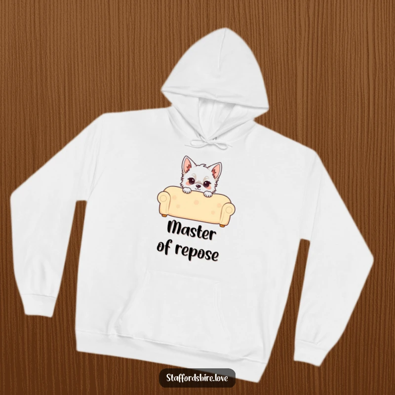 Funny Kawaii Staffordshire Hoodie, featuring a cute Staffy peeking over a couch, offering cozy comfort and a touch of playful humor.