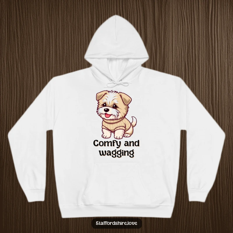 Funny hoodie depicting a fluffy Staffordshire dog in a sweater, with a happily wagging tail, embodying cozy canine warmth.