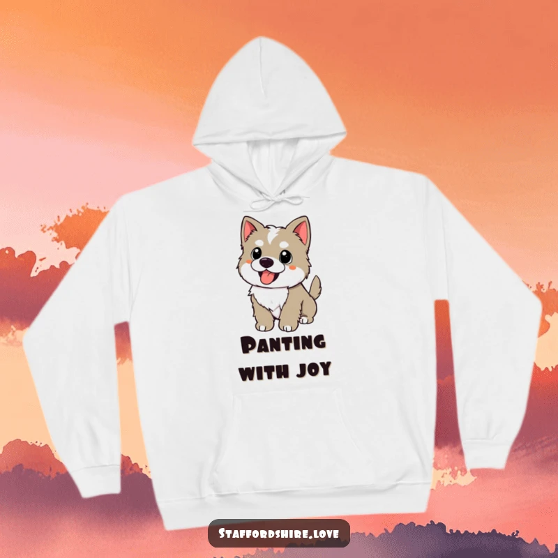 Funny kawaii Staffordshire puppy with a wagging tail, panting happily on a hoodie, offering cozy and humorous joy.