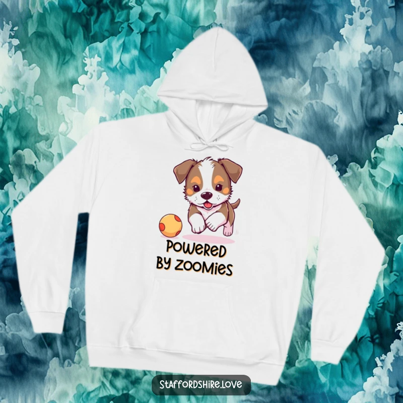 Funny, cute Staffordshire puppy chasing a bouncy ball on a warm hoodie. Perfect for dog lovers.
