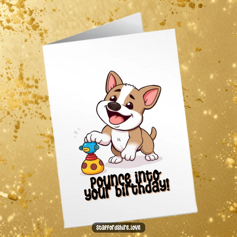 Funny free printable birthday card: a happy Staffordshire dog pounces playfully at a toy on all fours.