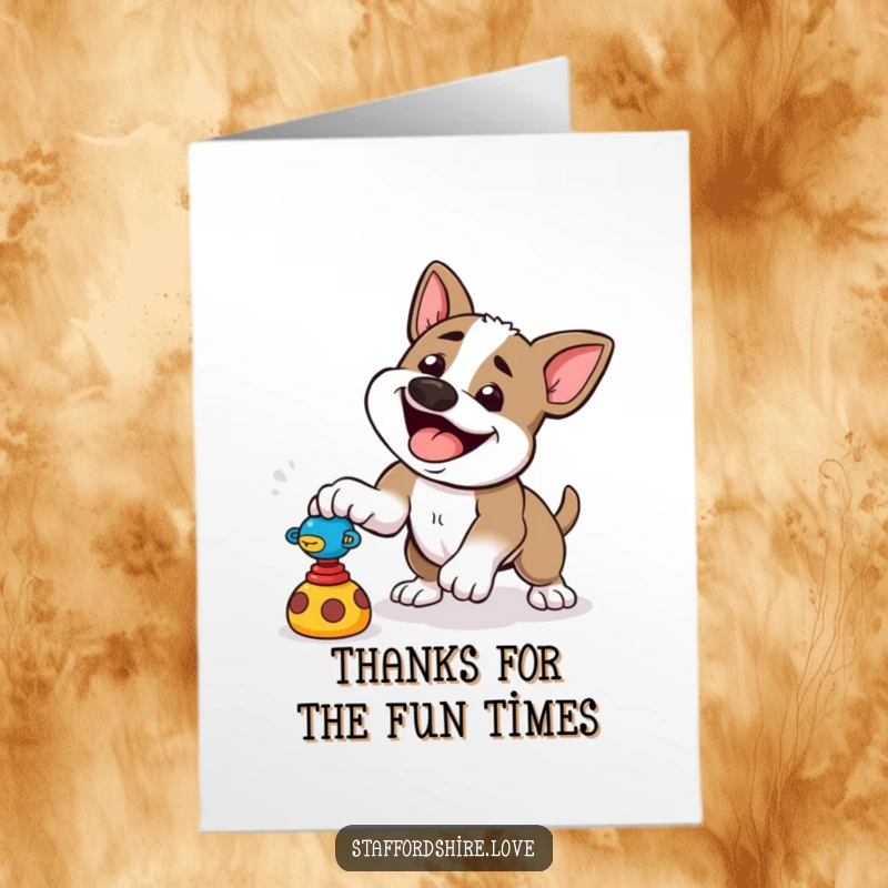 Funny free printable thank you card: a Staffordshire dog playfully pounces towards a toy, full of energy.