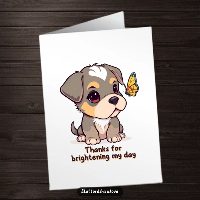 Funny Free Printable Thank You Card: A Staffordshire pup with a floppy ear, curiously observing a fluttering butterfly to express its thanks.