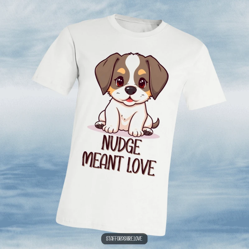 Funny kawaii Staffordshire puppy with floppy ears, playfully nudging on a t-shirt, celebrating playful dog energy.