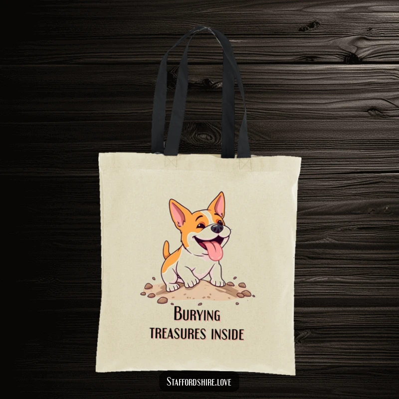Funny, energetic Staffordshire dog with a happy pant, digging enthusiastically in soft earth on a durable and stylish tote bag.