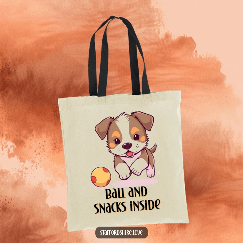 Funny, adorable Staffordshire puppy chasing a bouncy ball on a tote bag. Ideal funny gift for shoppers.